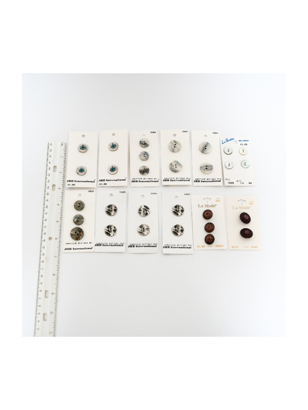 New - Vintage group of 27 buttons, various materials and sizes